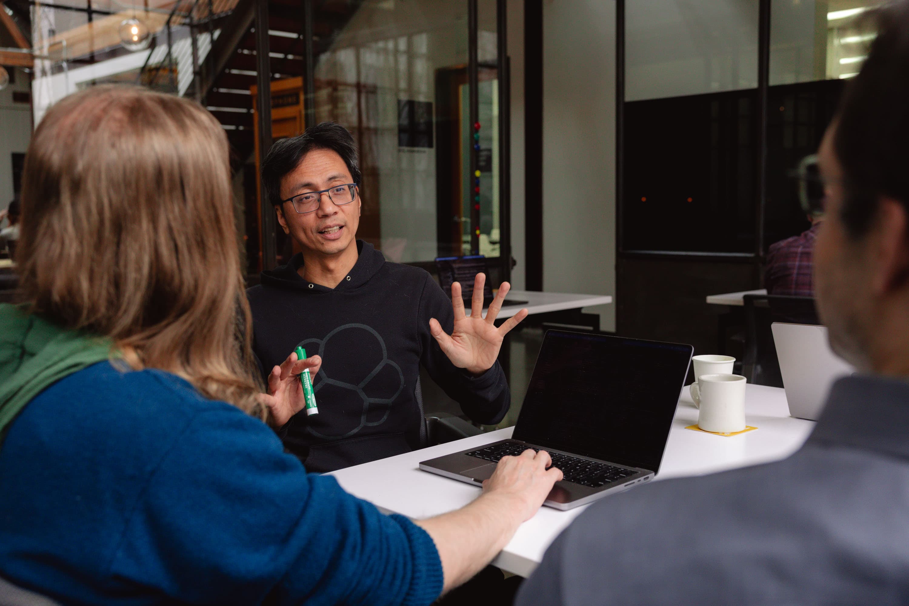 Olio Apps team discussing mobile solutions