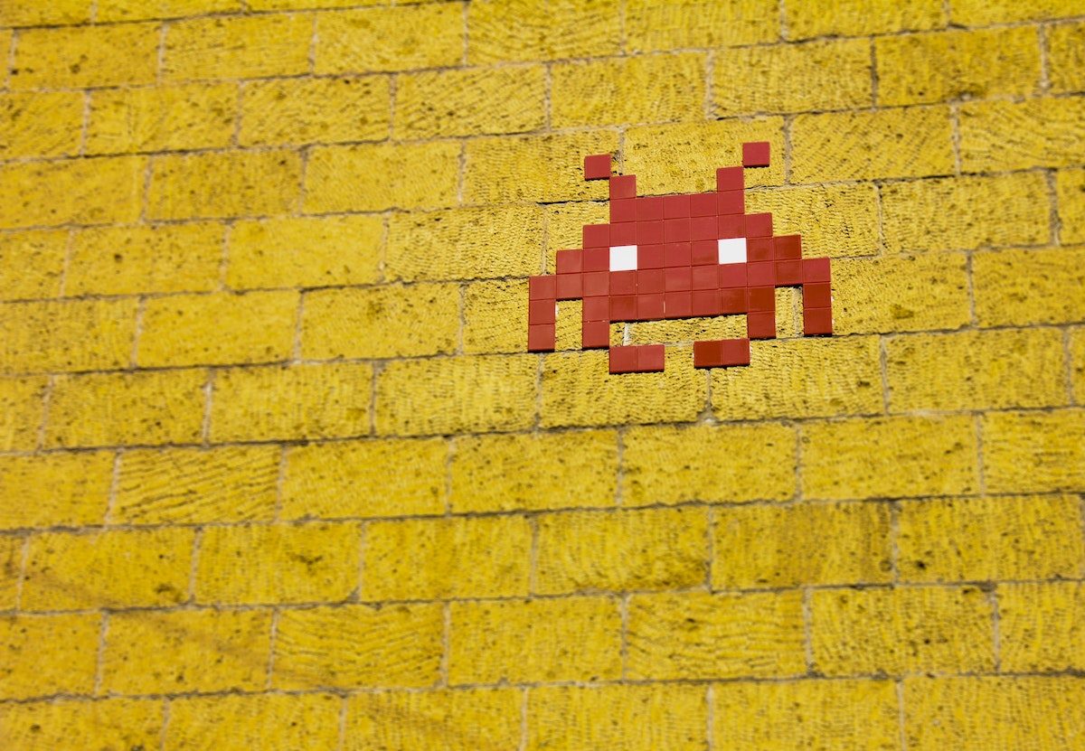 A photograph of a mural of a space invaders sprite by Francesco Ungaro via Pexels